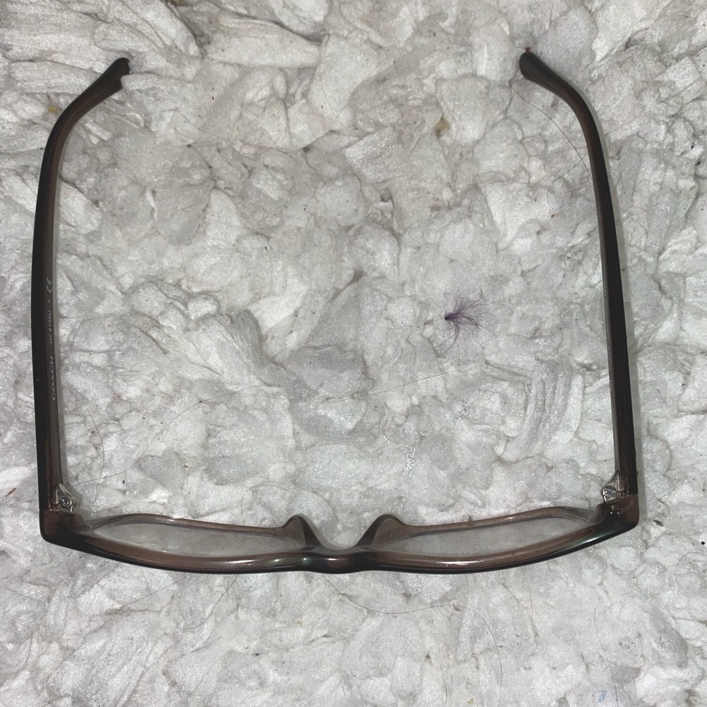 Coach Glasses in a dark grey w/ sparkles in the rims. Lenses can be removed.